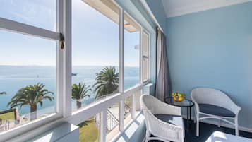 Family Room, Sea View | Minibar, in-room safe, desk, laptop workspace