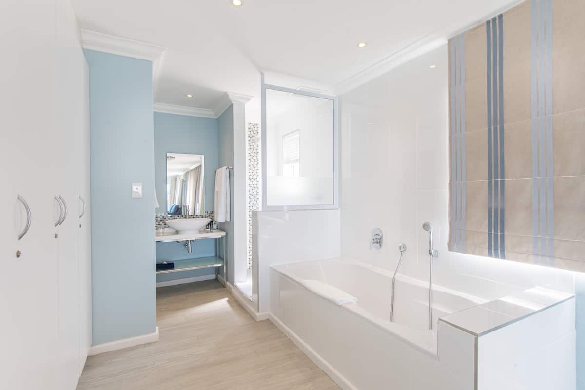 luxury studio suite | bathroom | free toiletries, hair dryer, towels, soap