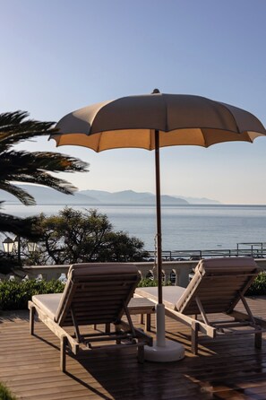 Seasonal outdoor pool, pool umbrellas, pool loungers