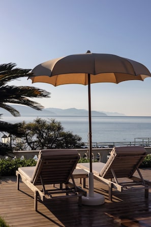 Seasonal outdoor pool, pool umbrellas, pool loungers
