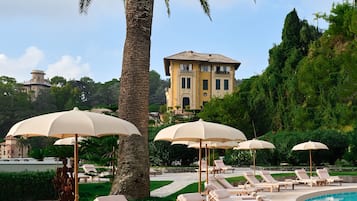 Seasonal outdoor pool, pool umbrellas, pool loungers