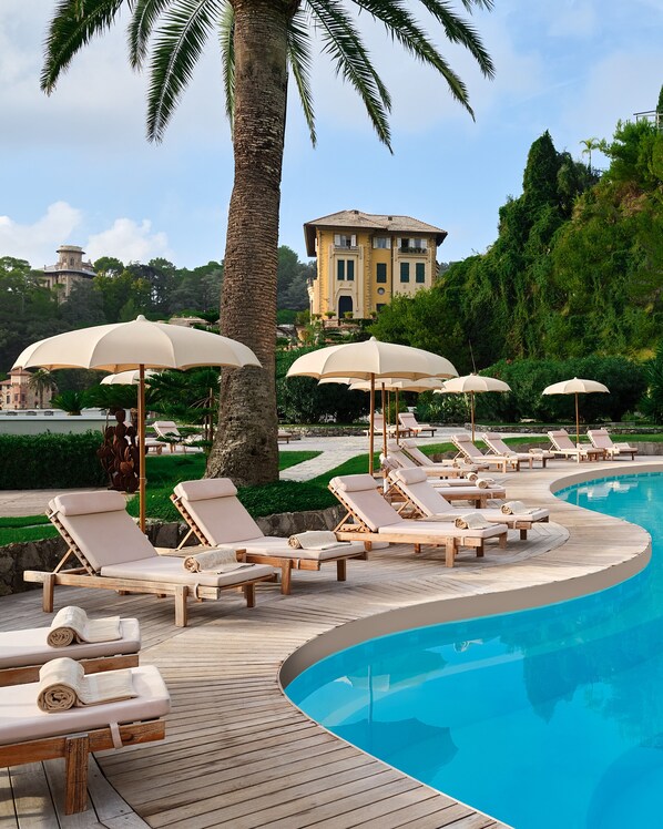 Seasonal outdoor pool, pool umbrellas, pool loungers
