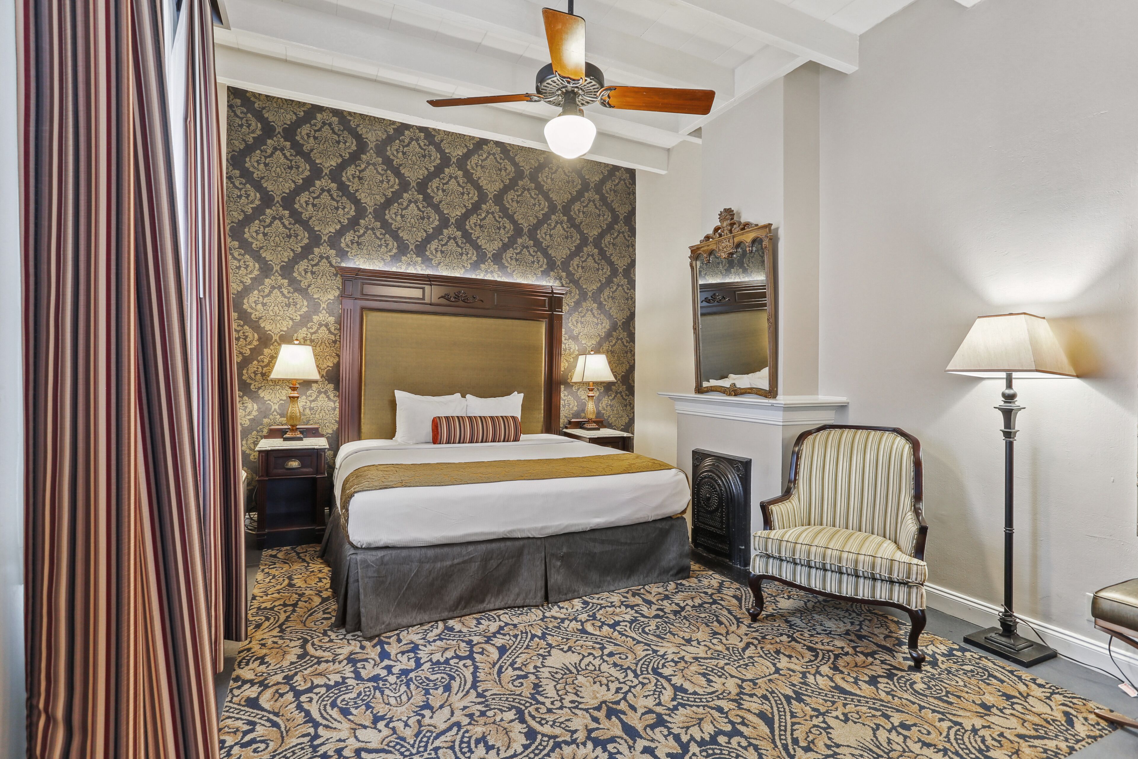 deluxe room, 1 king bed | in-room safe, individually decorated, desk, blackout curtains