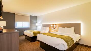 Premium bedding, pillow-top beds, desk, laptop workspace