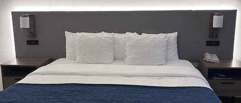 Premium bedding, pillow-top beds, desk, laptop workspace