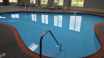 Indoor pool, pool umbrellas, pool loungers