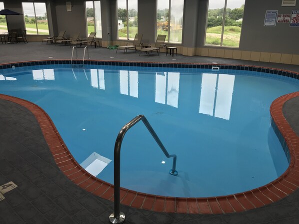 Indoor pool, pool umbrellas, pool loungers