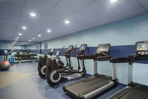 A gym with treadmills, ellipticals, and free weights. - Four Points by Sheraton Richmond (Richmond)