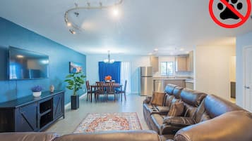 Family Apartment | Living area | 50-inch TV with satellite channels