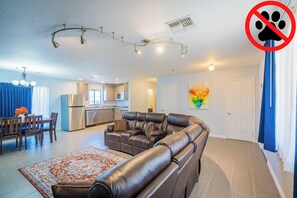 Family Apartment | Living area | 50-inch TV with satellite channels - Rio del Sol Inn (Needles)
