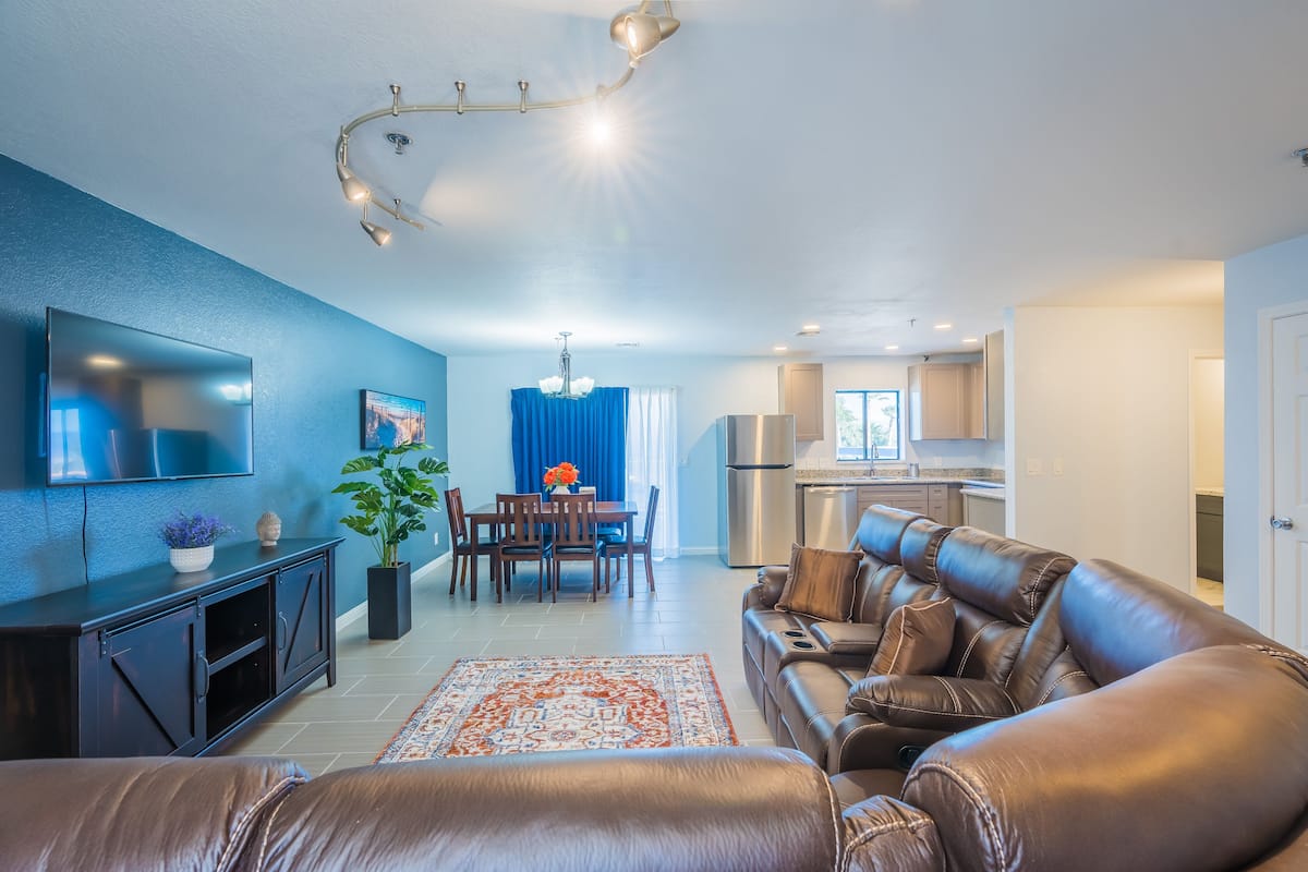 Family Apartment | Living area | 50-inch TV with satellite channels