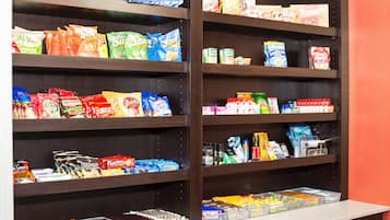 Shelves stocked with various snacks and packaged goods.