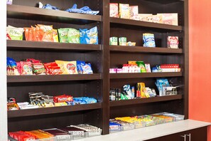 Shelves stocked with various snacks and packaged goods. - Holiday Inn Express & Suites Oklahoma City Southeast I-35 by IHG (Oklahoma City)