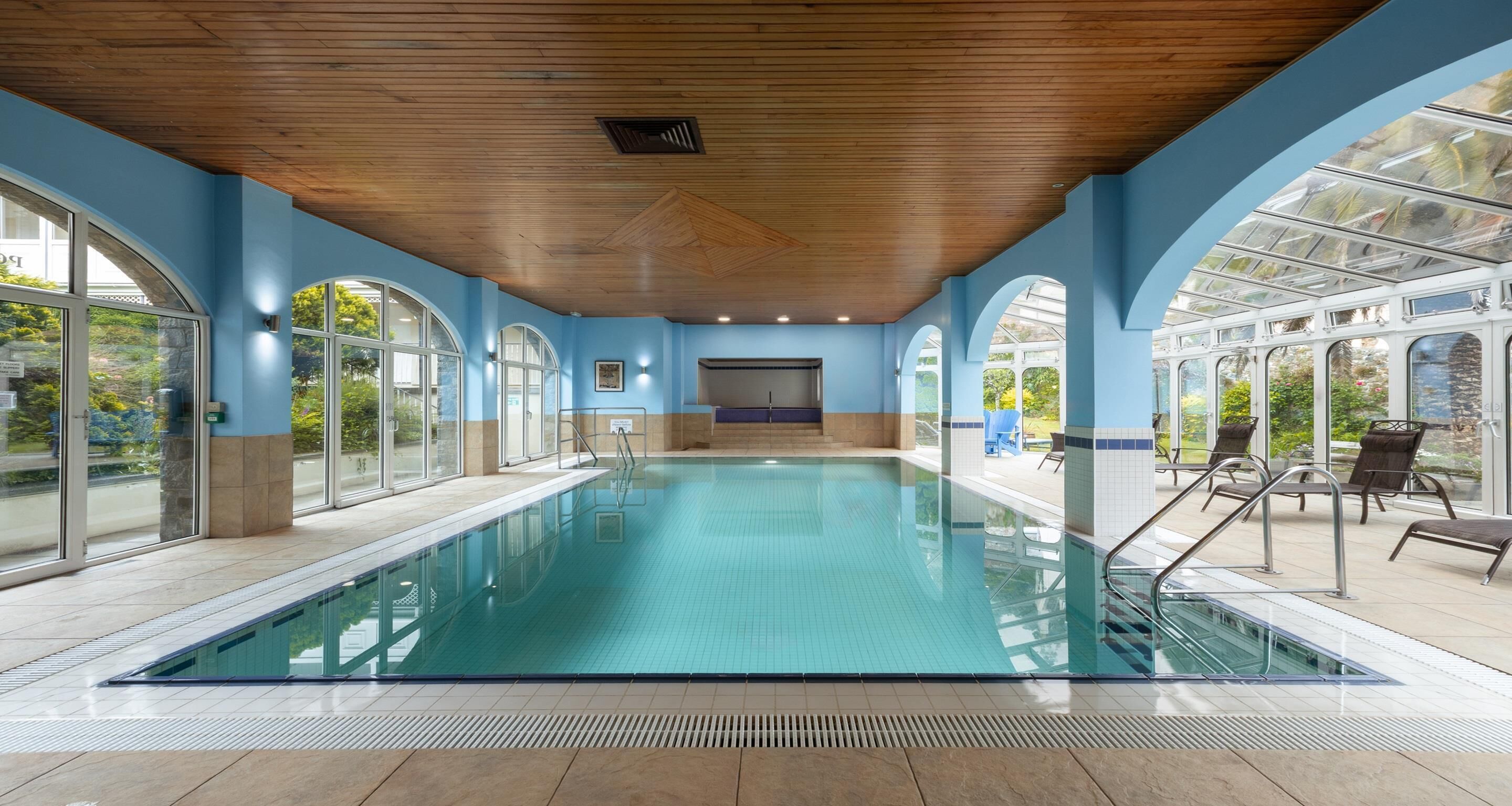 Indoor pool, open 7 AM to 9 PM, sun loungers