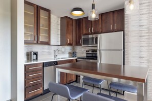 Suite, 2 Bedrooms | Private kitchen | Fridge, microwave, stovetop, dishwasher