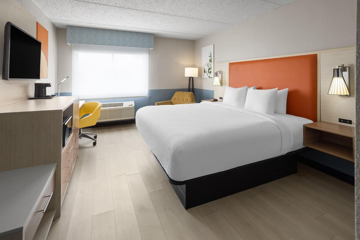 Suite, 1 King Bed, Non Smoking, Jetted Tub | Desk, laptop workspace, blackout drapes, rollaway beds