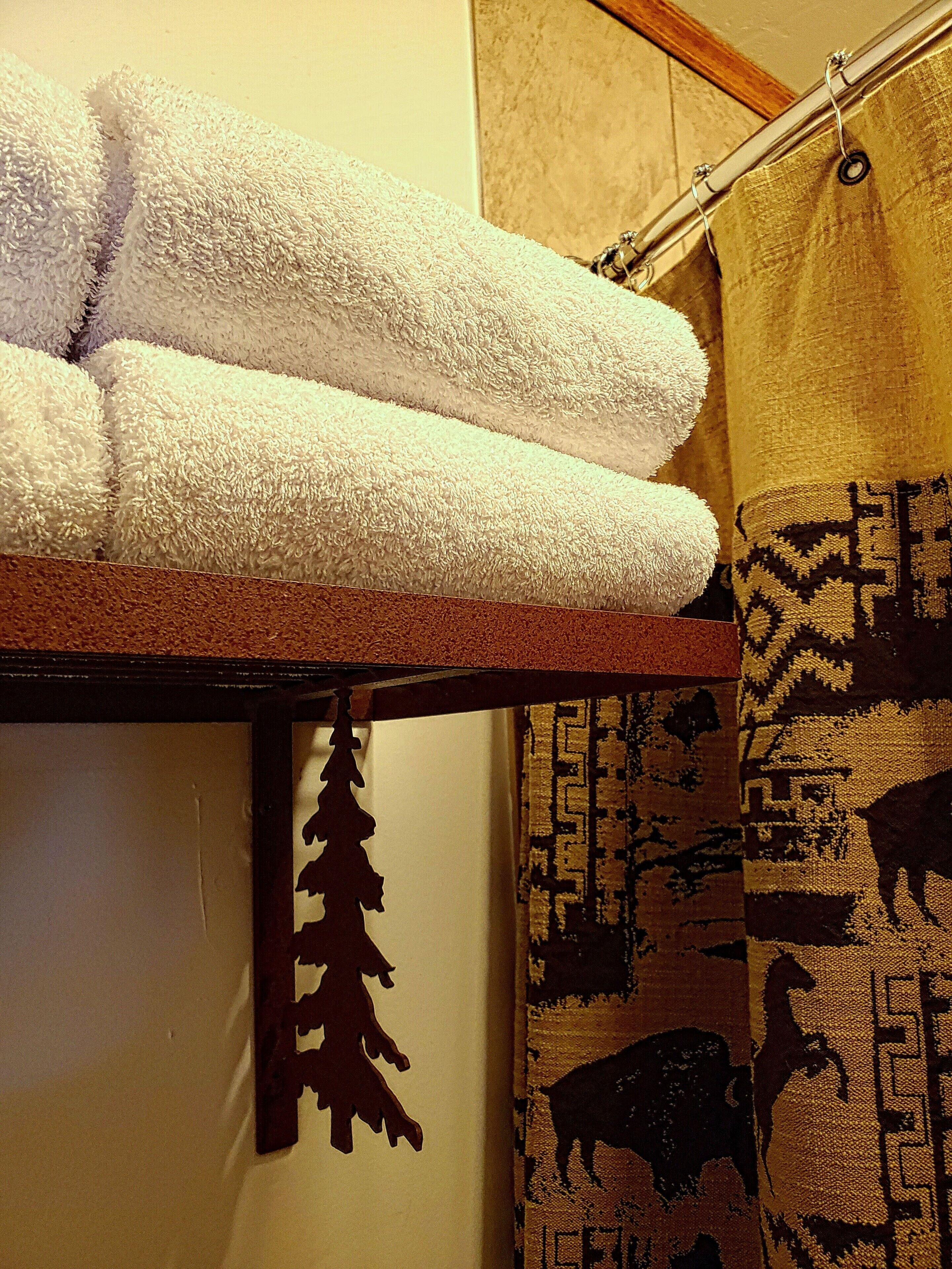 designer toiletries, hair dryer, towels, soap