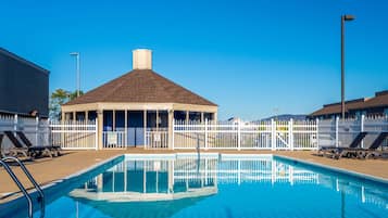 Seasonal outdoor pool, open 9:00 AM to 9:00 PM, pool umbrellas
