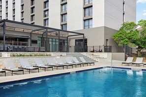 Outdoor pool, open 6:00 AM to 11:00 PM, pool loungers