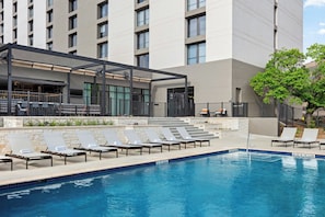 Outdoor pool, open 6:00 AM to 11:00 PM, pool loungers