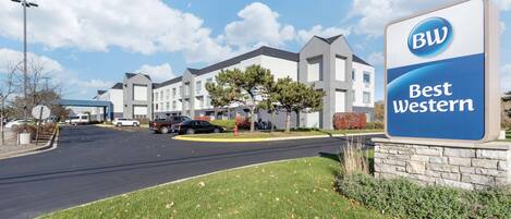A Best Western hotel with a modern design, featuring a prominent sign and a well-maintained lawn in front.