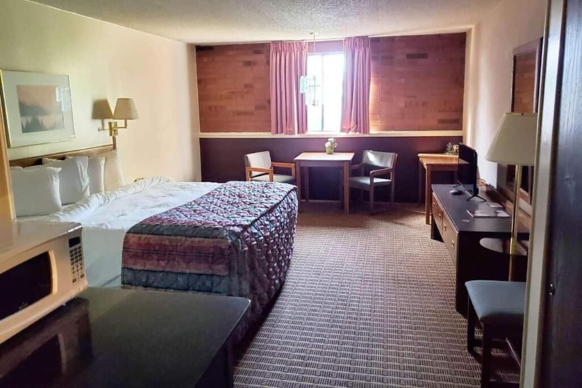 Premium bedding, desk, laptop workspace, blackout curtains