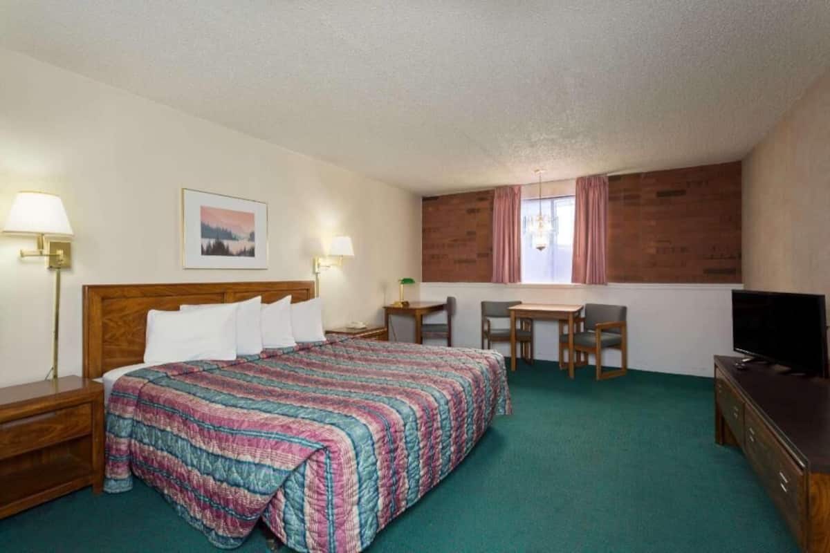 Premium bedding, desk, laptop workspace, blackout curtains