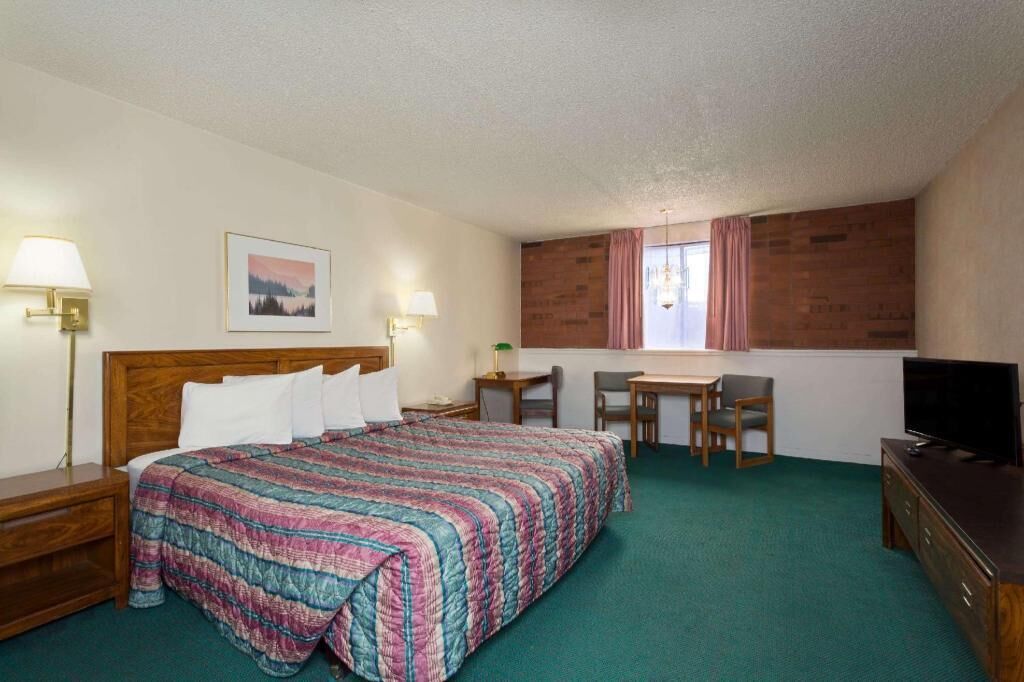 Premium bedding, desk, laptop workspace, blackout curtains
