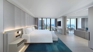 A modern hotel room with a large bed, a desk, and a balcony with a city view. - JW Marriott Gold Coast Resort & Spa (Surfers Paradise)