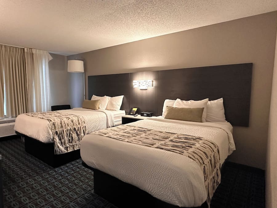 Premium bedding, desk, laptop workspace, iron/ironing board