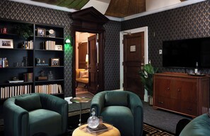 Suite, 1 Bedroom | Living area | 55-inch flat-screen TV with cable channels, TV