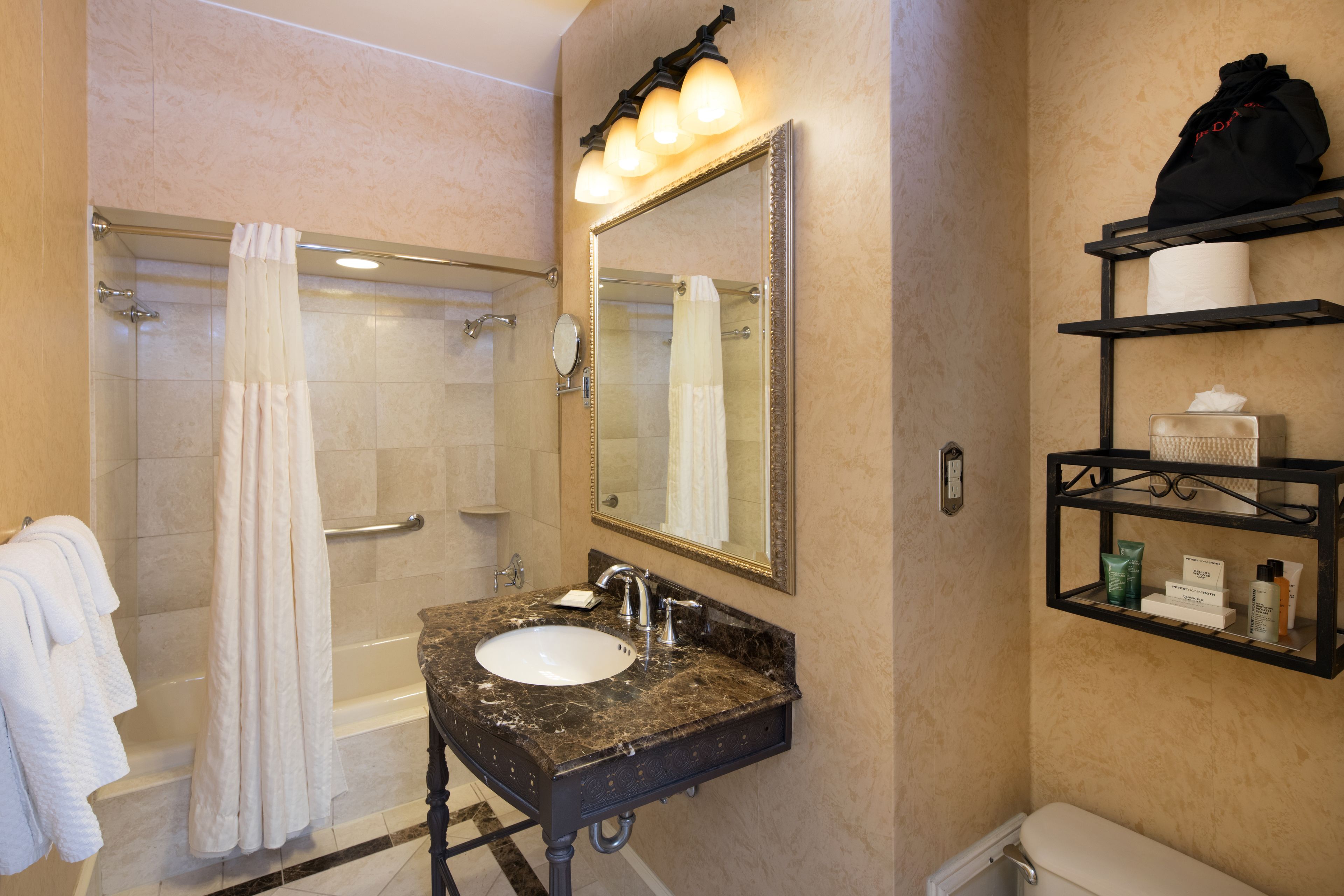 designer toiletries, hair dryer, towels