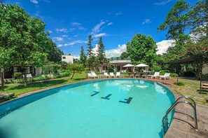 Outdoor pool, open 9:00 AM to 7:30 PM, pool umbrellas, pool loungers