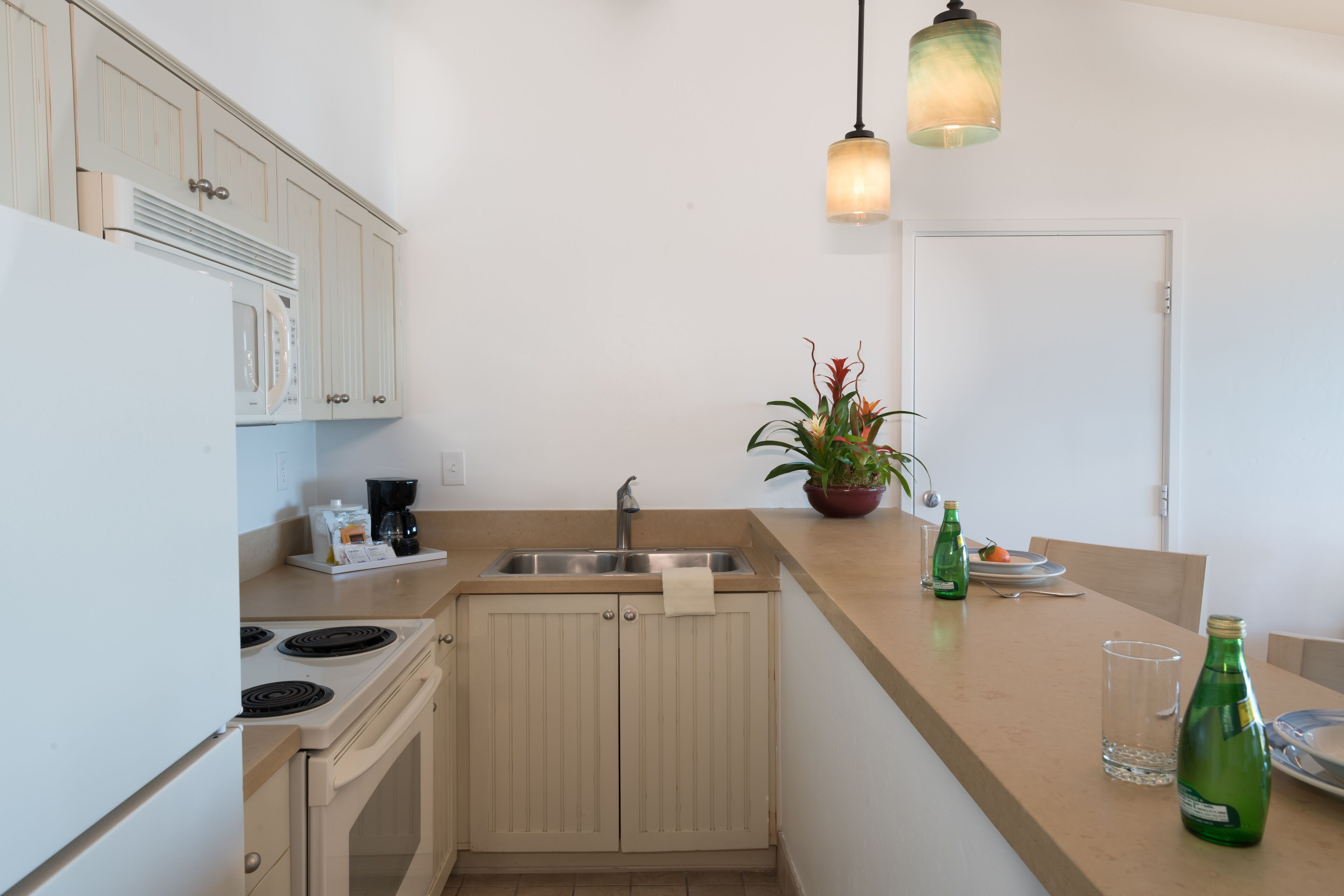 mini-fridge, coffee/tea maker, cookware/dishes/utensils