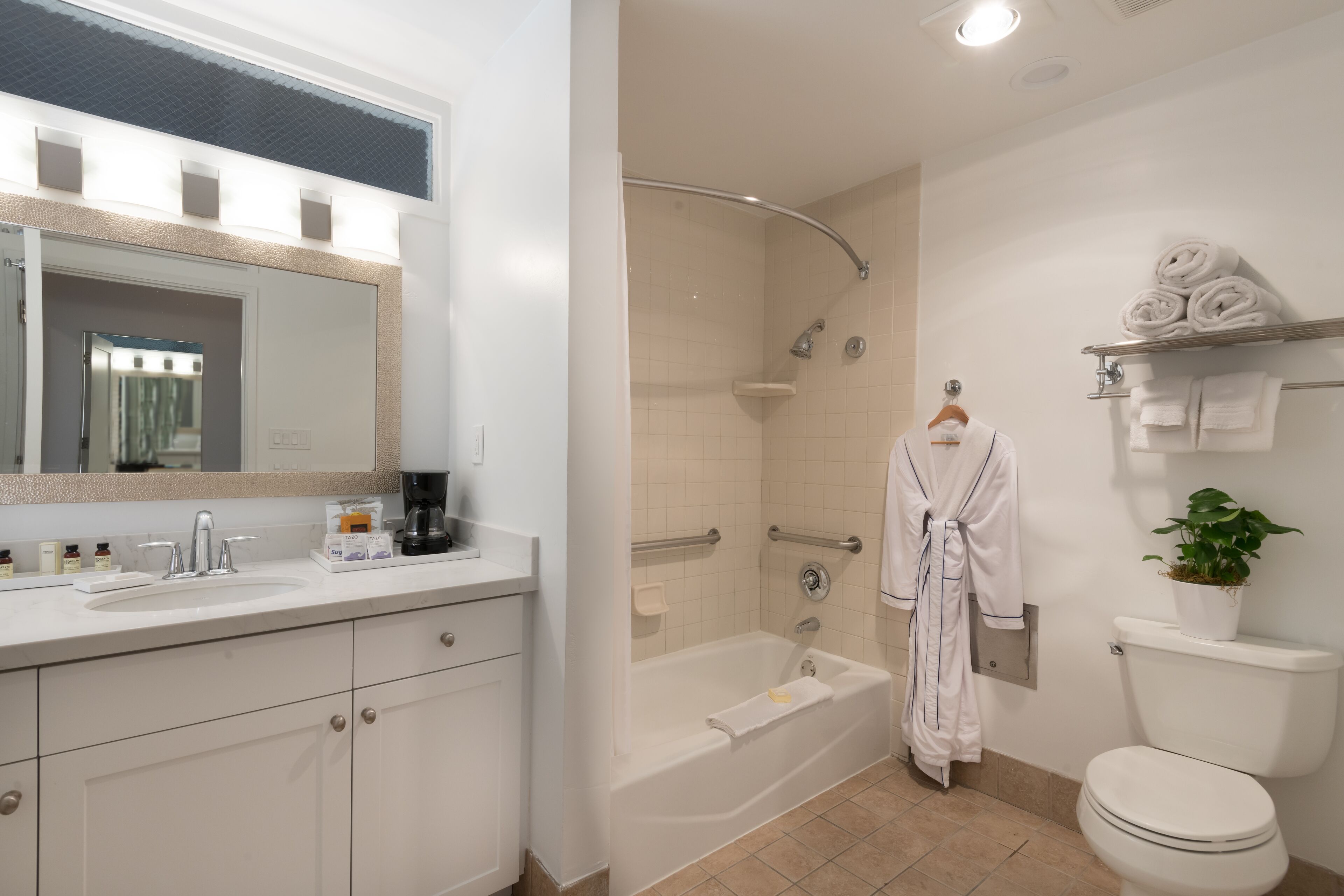 deluxe room, 1 king bed, ocean view (beachfront view with kitchenette) | bathroom | combined shower/bathtub, eco-friendly toiletries, hair dryer, bathrobes