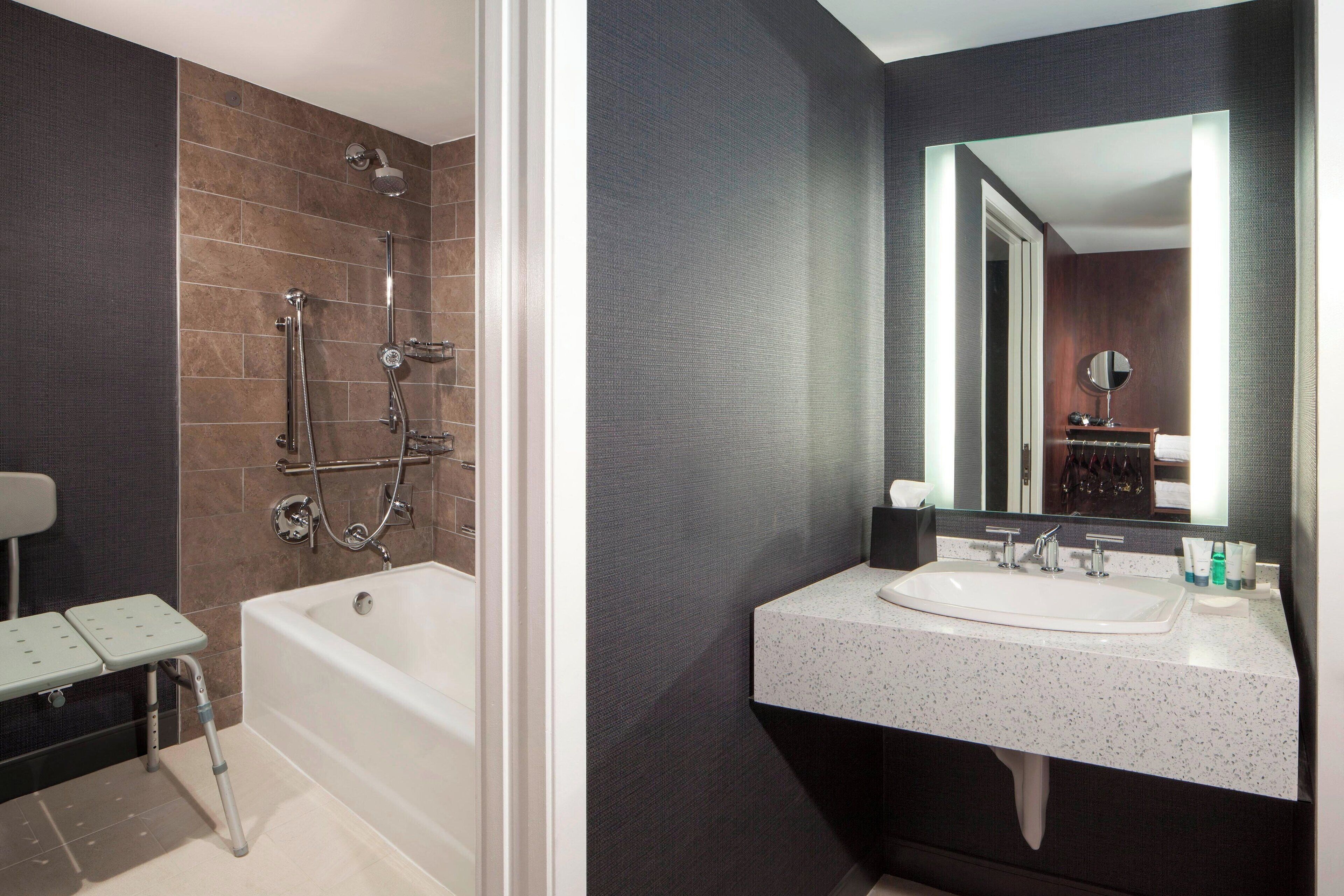 combined shower/bathtub, designer toiletries, hair dryer, towels