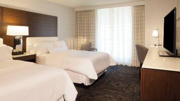 Premium bedding, down comforters, pillowtop beds, in-room safe