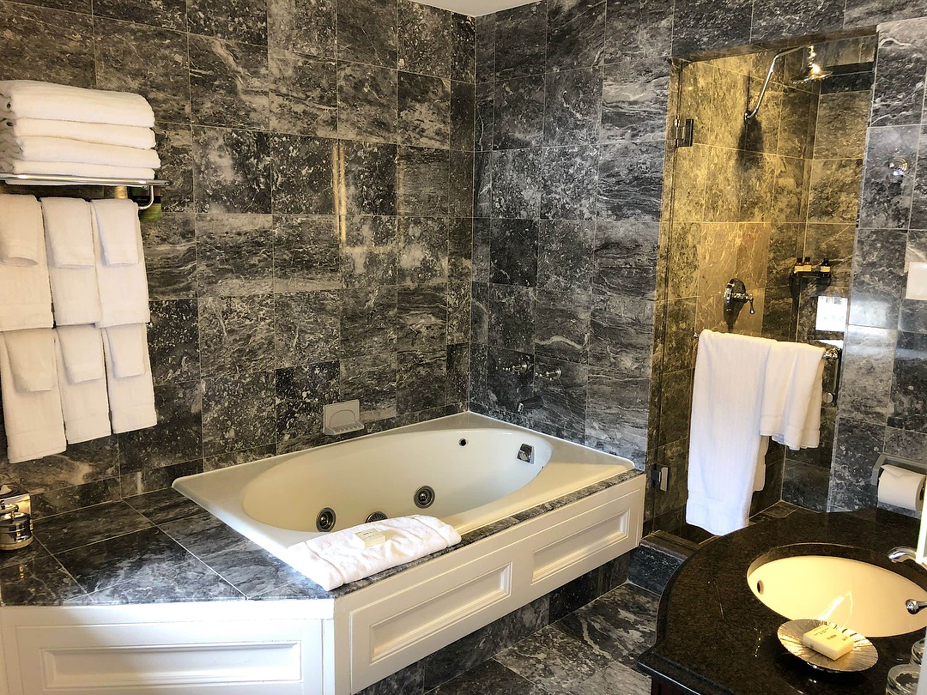 presidential suite, 1 king bed (best view) | bathroom | combined shower/bathtub, designer toiletries, hair dryer, bathrobes