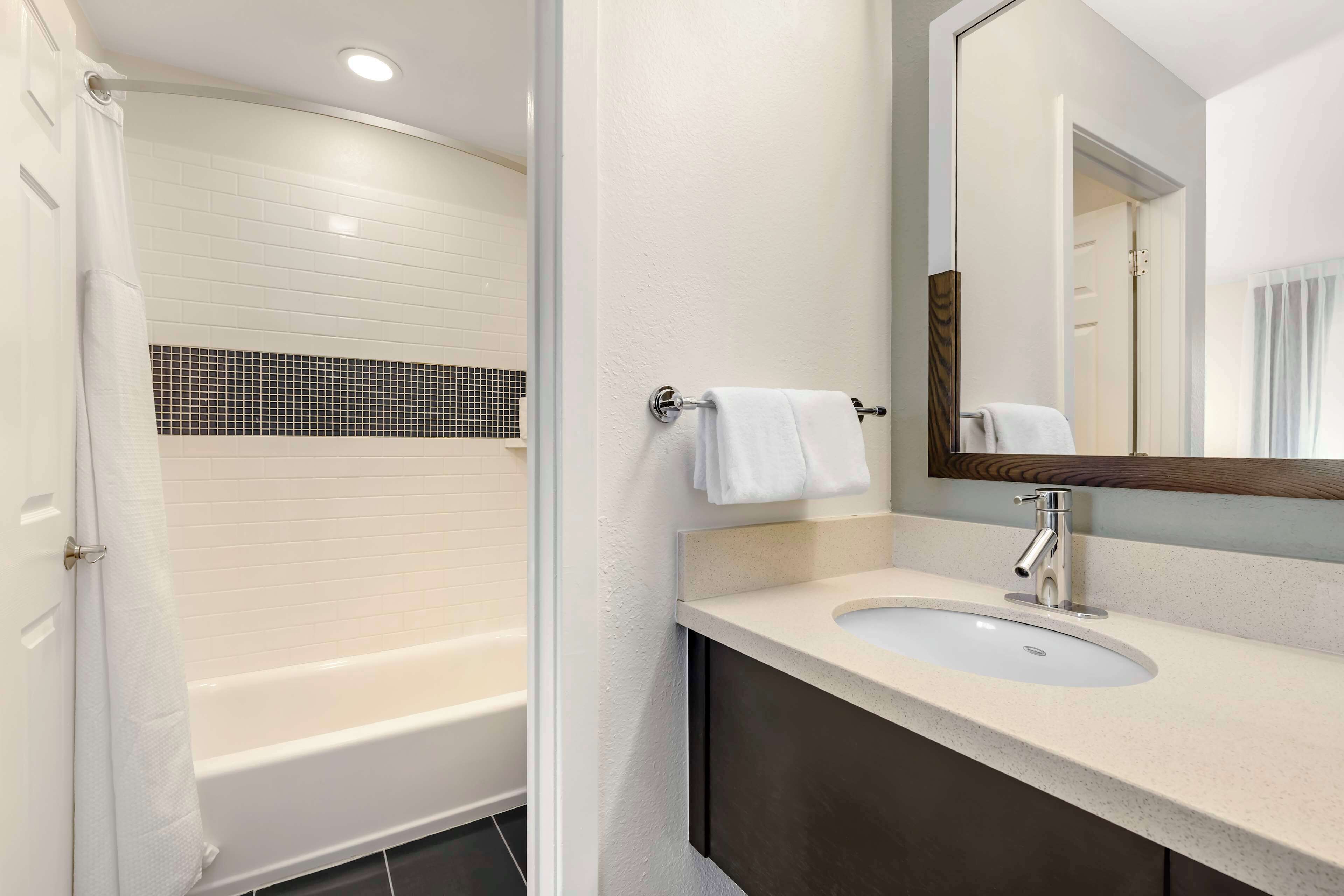 designer toiletries, hair dryer, towels, soap