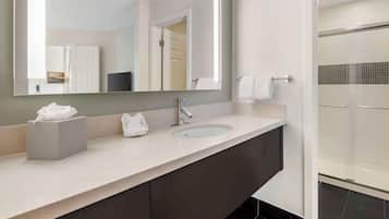 Suite, 1 King Bed (One Bedroom) | Bathroom | Designer toiletries, hair dryer, towels, soap