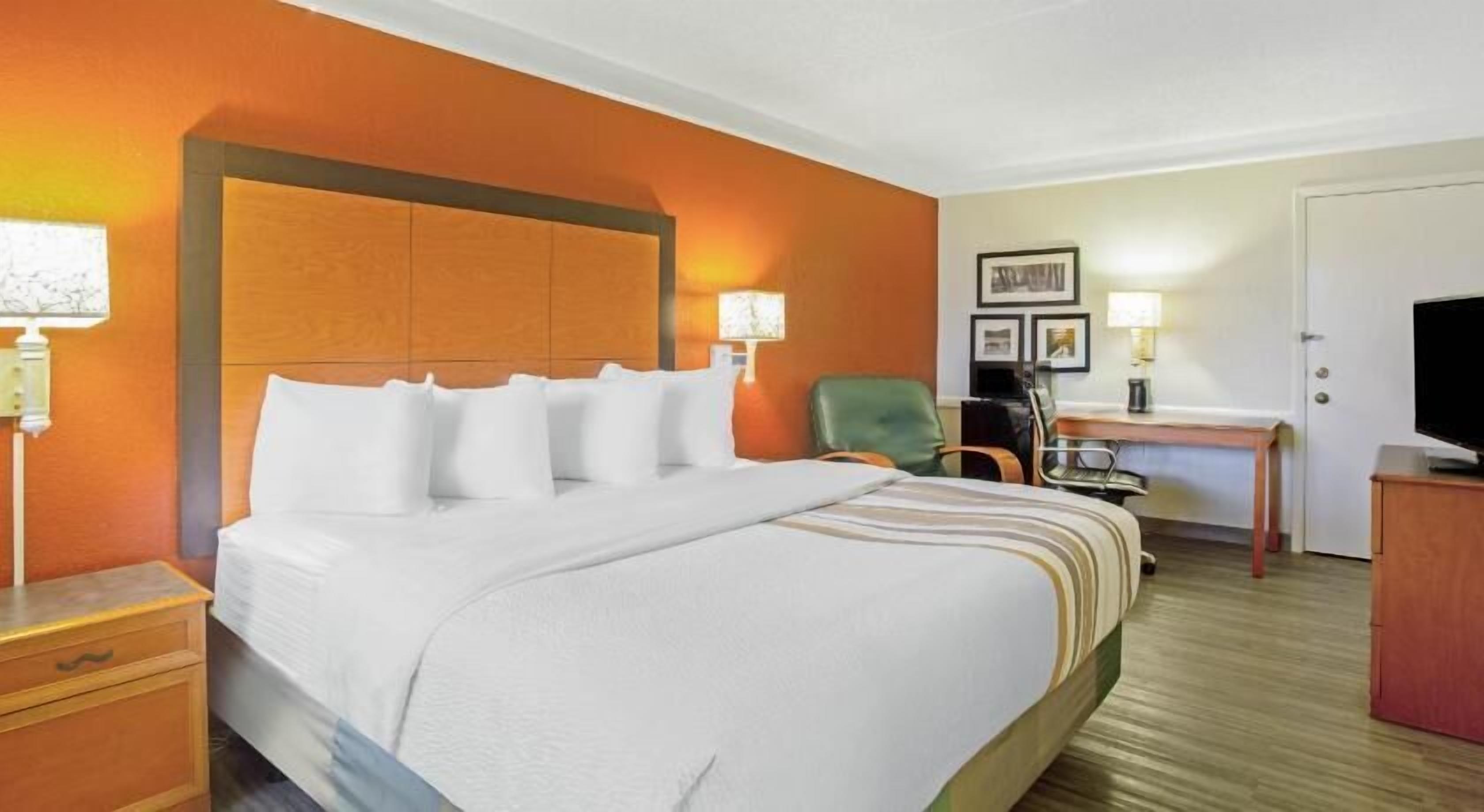 Premium bedding, pillow-top beds, desk, laptop workspace