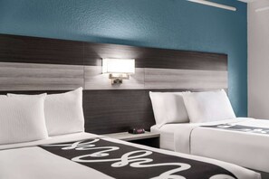 Premium bedding, pillowtop beds, desk, laptop workspace