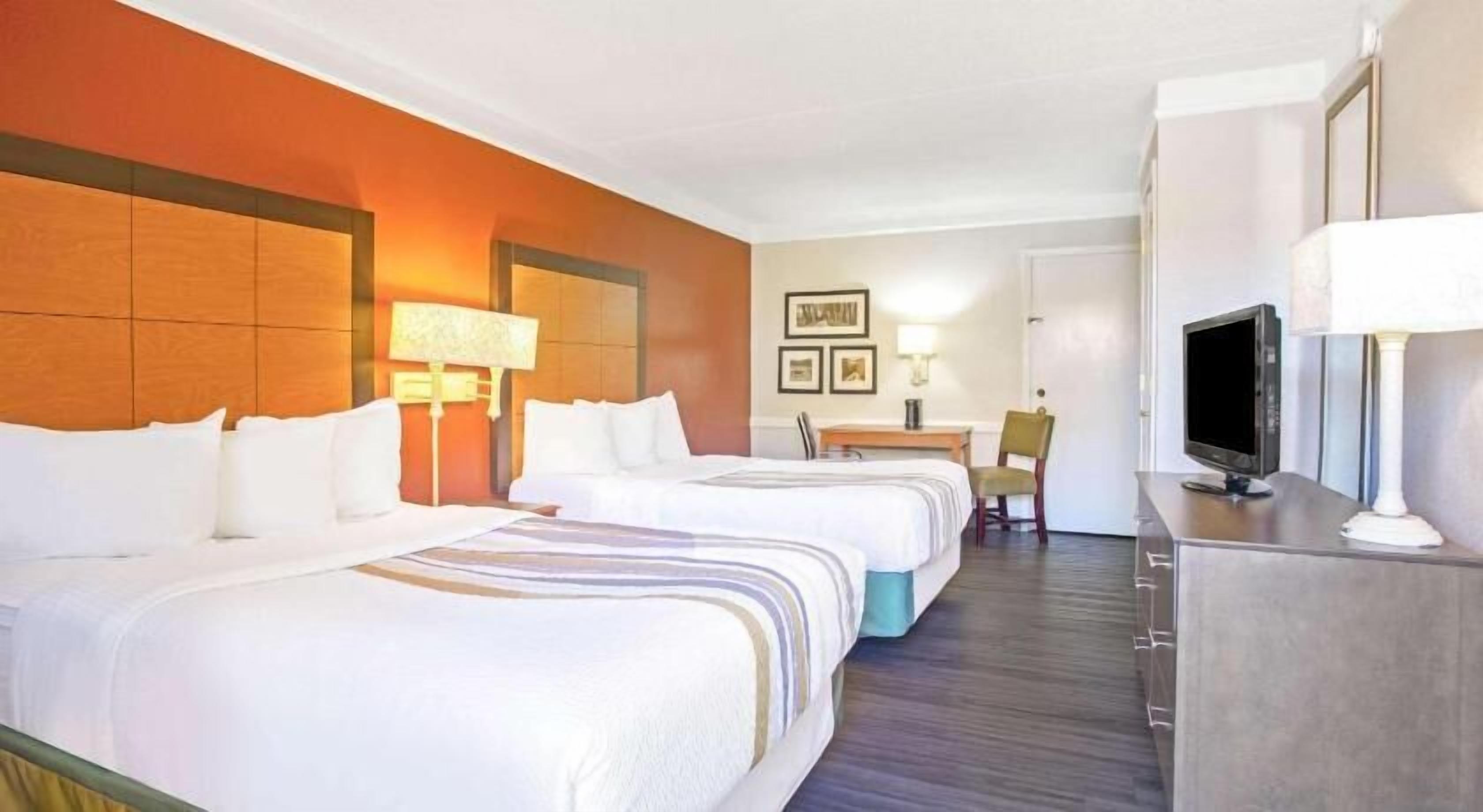 Premium bedding, pillow-top beds, desk, laptop workspace