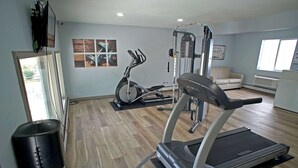 A home gym with a treadmill, elliptical, and weight machine. - Baymont | Monte Vista (Monte Vista)