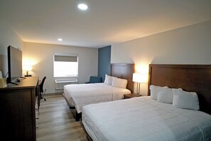 Premium bedding, desk, laptop workspace, blackout drapes