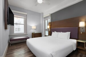 Suite, 1 King Bed, Accessible, Non Smoking (with Sofabed) | Pillowtop beds, desk, laptop workspace, blackout drapes