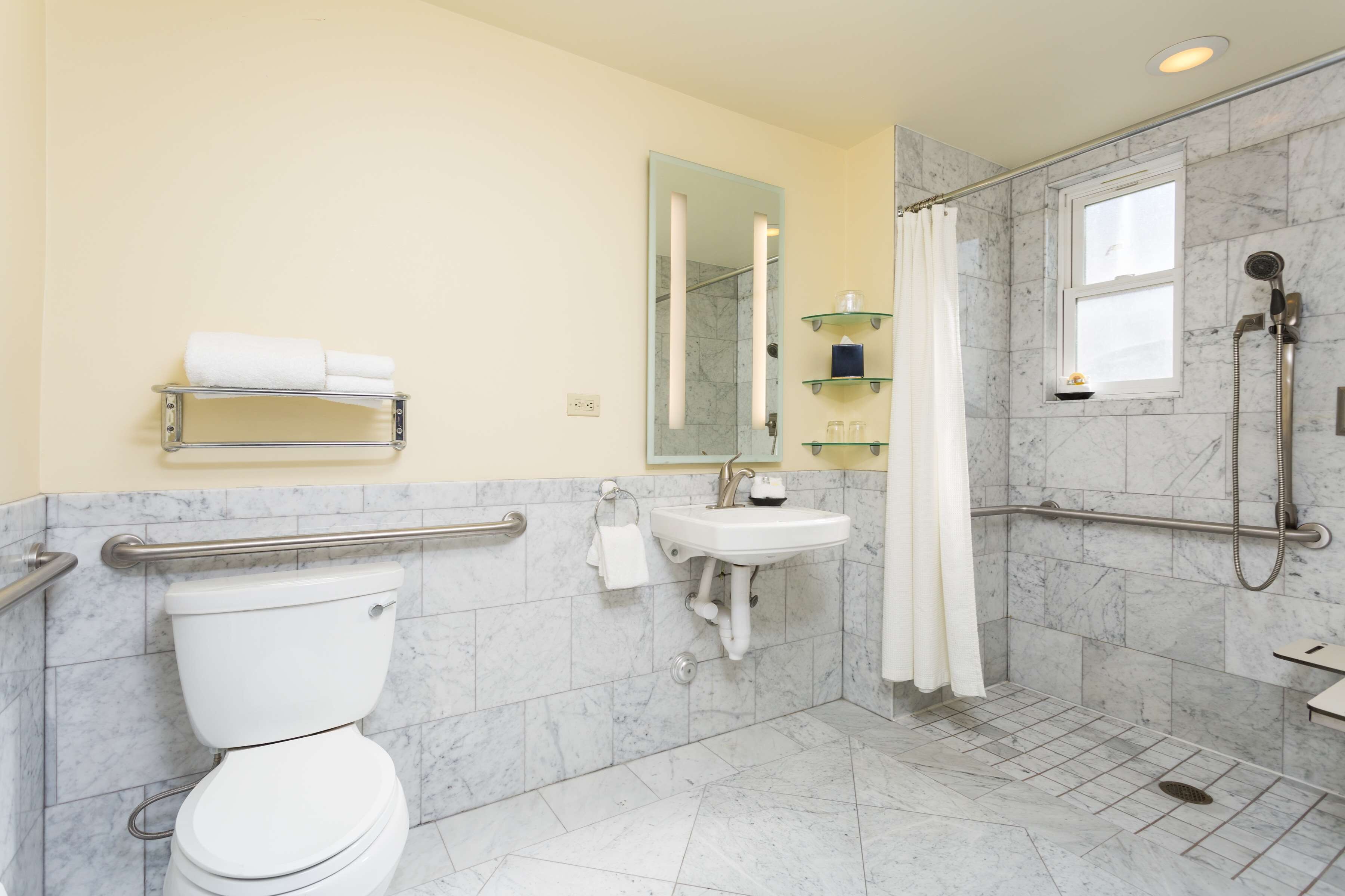 designer toiletries, hair dryer, towels