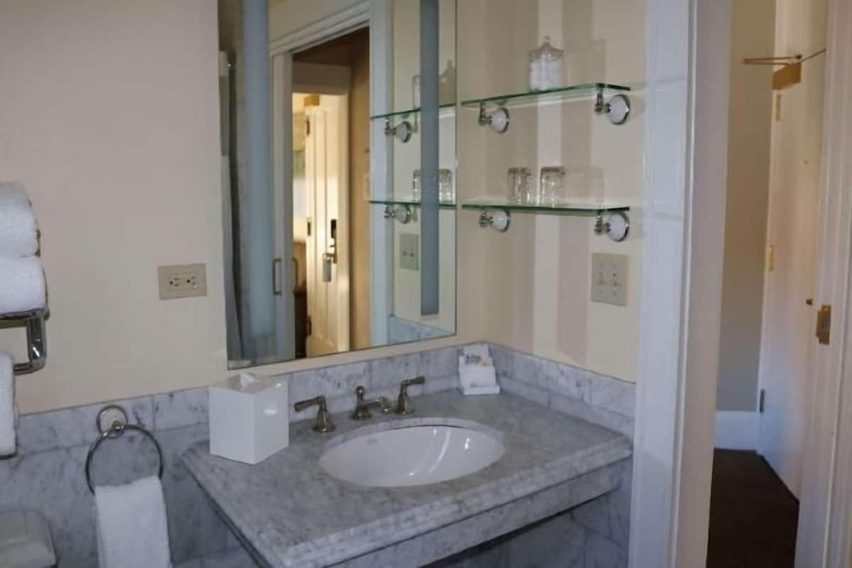 Designer toiletries, hair dryer, towels, soap