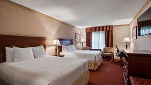 Premium bedding, pillow-top beds, desk, laptop workspace