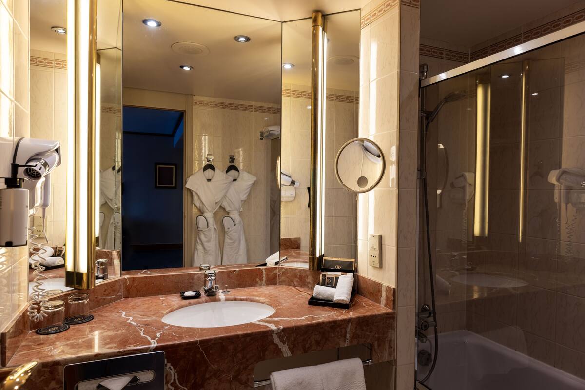 designer toiletries, hair dryer, bathrobes, slippers